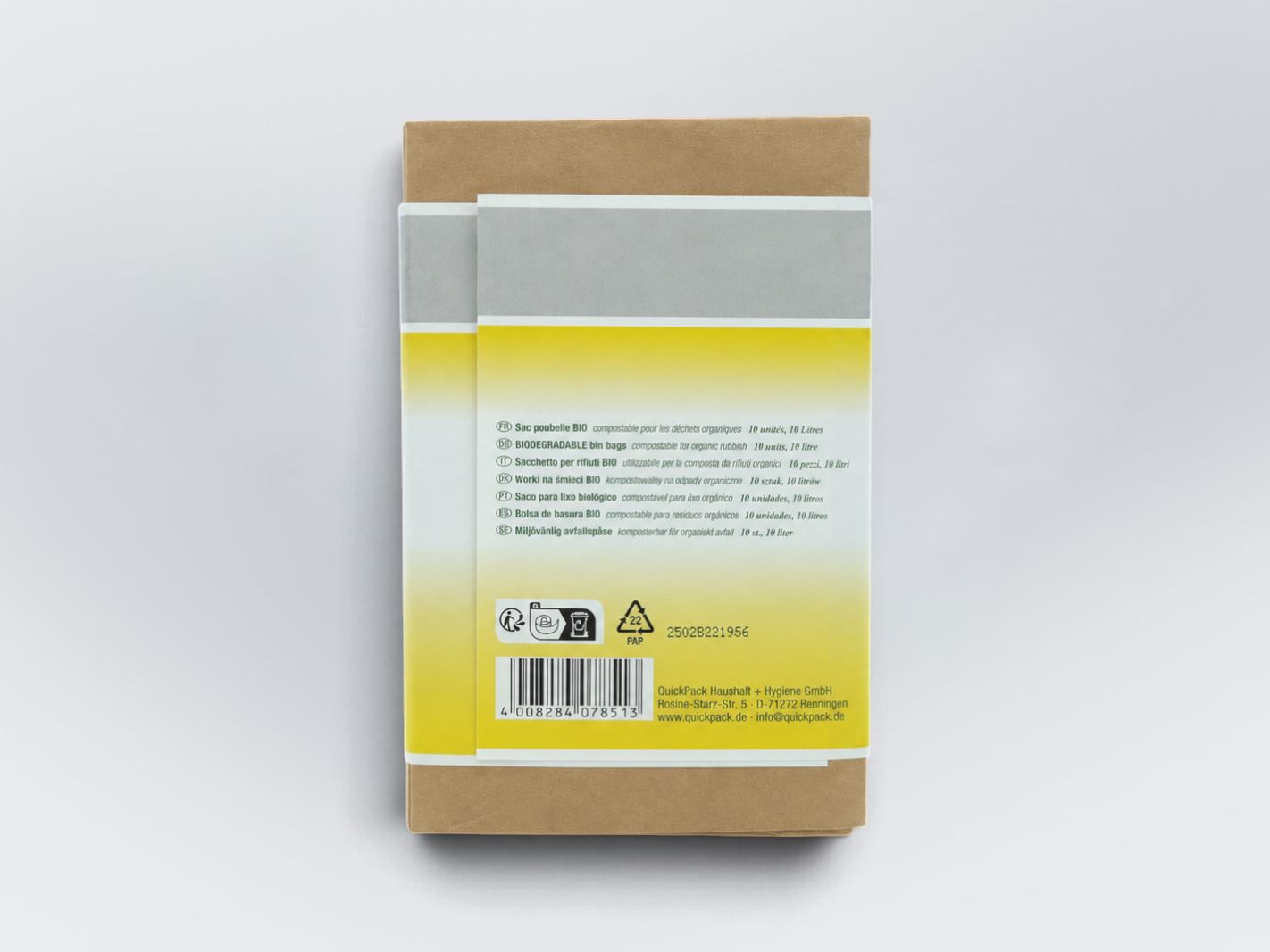 postconsumer packaging, brown cardboard, yellow label, white strip, barcode
